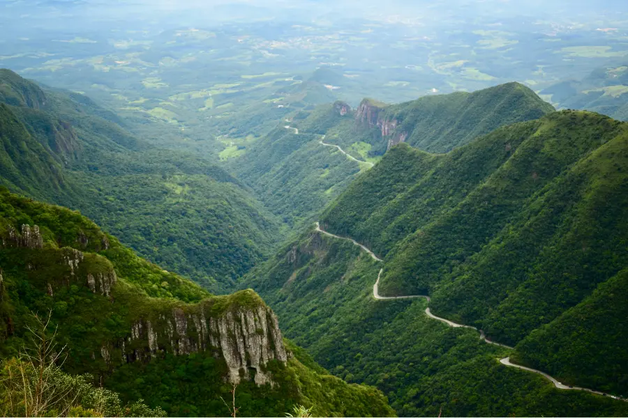A winding road through lush green mountains