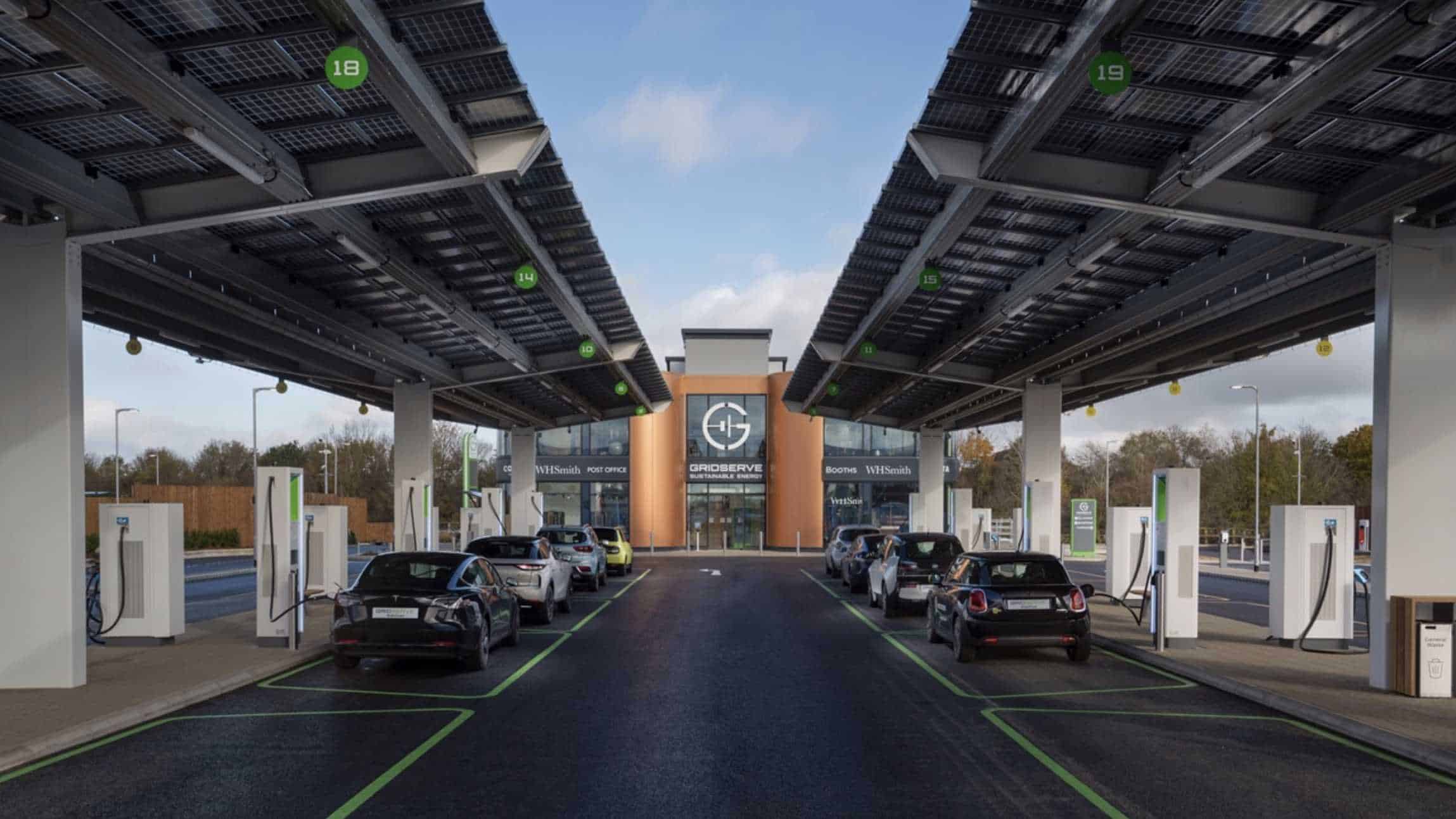 CGI rendering of a Gridserve electric forecourt with cars charging