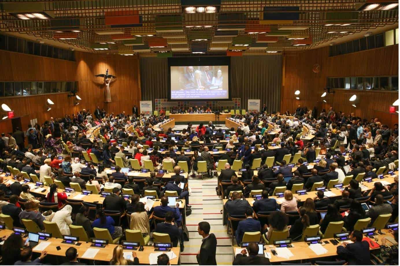 Conference hall packed with politicians.