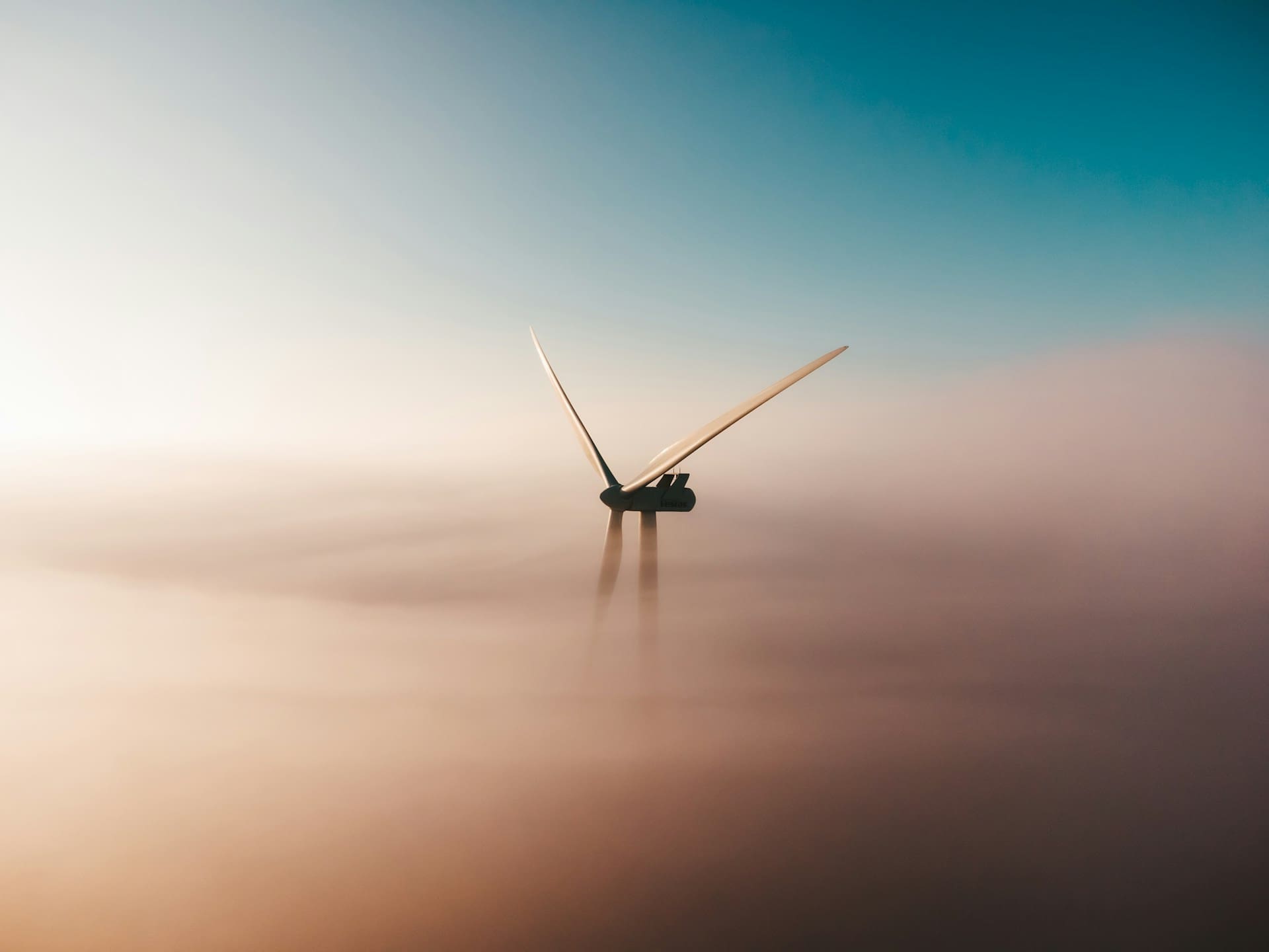 Early morning windmill sunrise in the mist